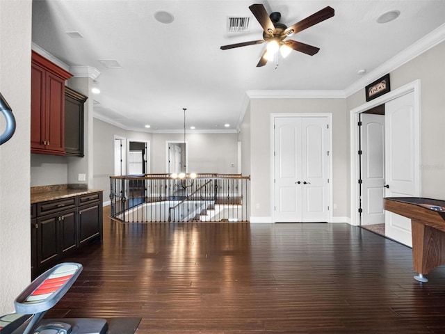 1417 Terralago Pl, Oviedo, FL 32765 - unfurnished living room featuring a ceiling fan, dark wood-type flooring, crown molding, a chandelier, and recessed lighting