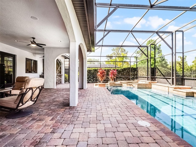 1417 Terralago Pl, Oviedo, FL 32765 - view of pool with a patio, ceiling fan, glass enclosure, and a pool with connected hot tub