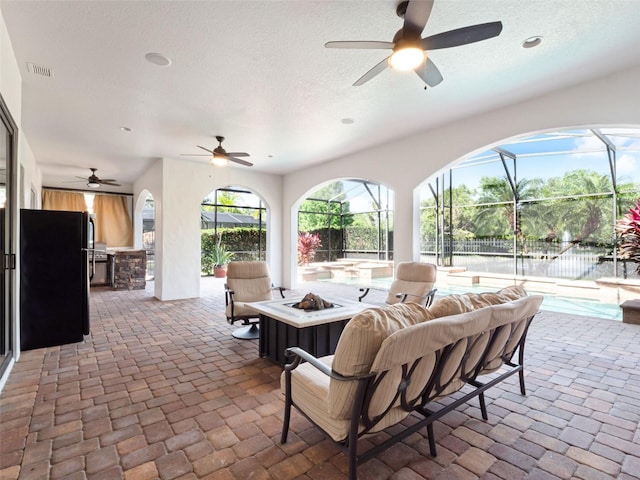 1417 Terralago Pl, Oviedo, FL 32765 - view of patio with ceiling fan, area for grilling, a fire pit, a lanai, and an outdoor pool