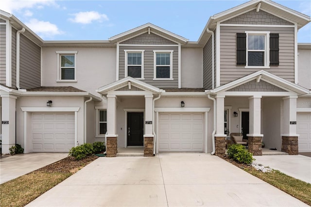 2716 Pierr St, Davenport, FL 33837 - townhome / multi-family property with concrete driveway, stucco siding, and a garage