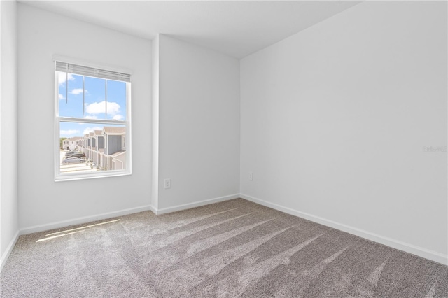 2716 Pierr St, Davenport, FL 33837 - carpeted spare room featuring baseboards