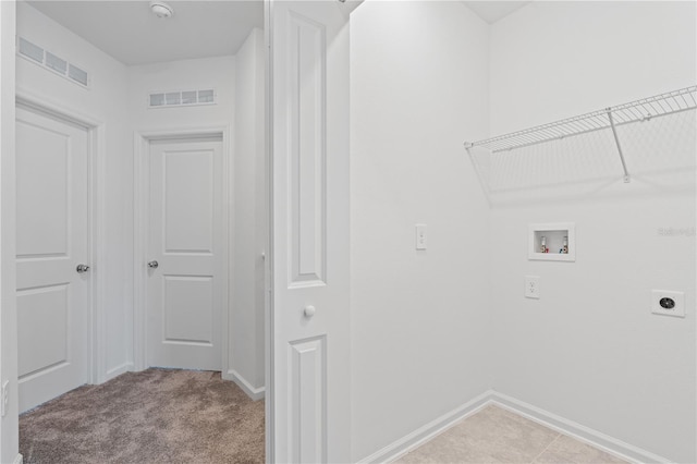 2716 Pierr St, Davenport, FL 33837 - laundry area with hookup for a washing machine, hookup for an electric dryer, baseboards, and light carpet