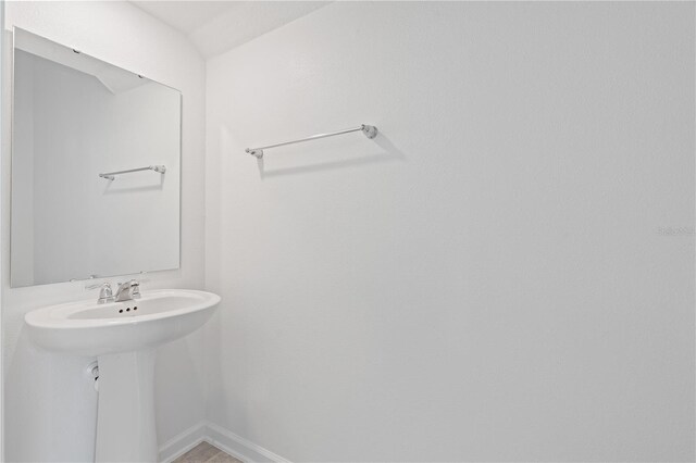 2716 Pierr St, Davenport, FL 33837 - bathroom featuring baseboards