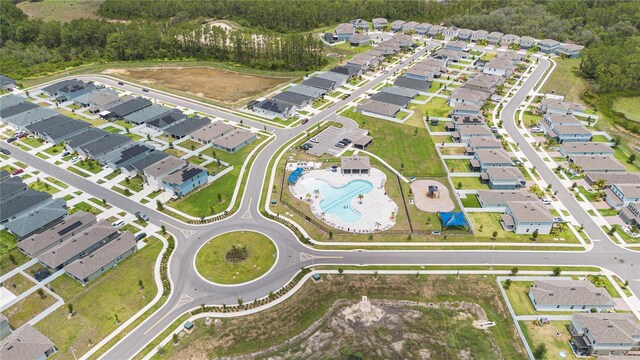 2716 Pierr St, Davenport, FL 33837 - aerial overview of property's location featuring a pool and nearby suburban area