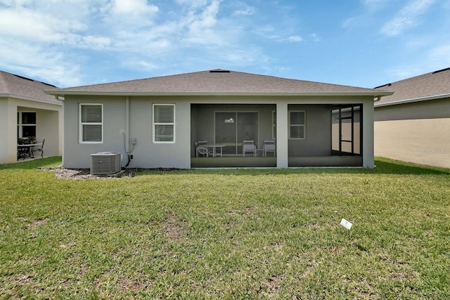 1580 Delphi Way, New Smyrna Beach, FL 32168 - back of property featuring a sunroom, a yard, stucco siding, and cooling unit