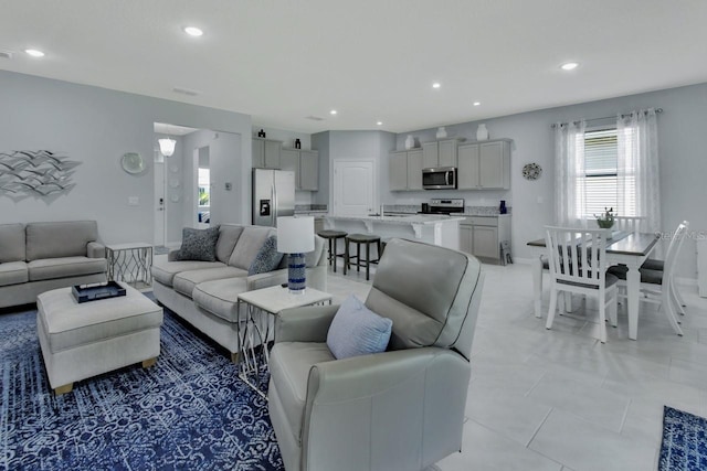 1580 Delphi Way, New Smyrna Beach, FL 32168 - living room with recessed lighting and baseboards