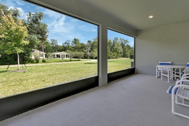 1580 Delphi Way, New Smyrna Beach, FL 32168 - sunroom / solarium with view of wooded area
