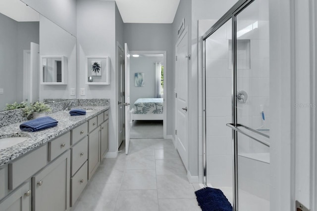 1580 Delphi Way, New Smyrna Beach, FL 32168 - bathroom featuring connected bathroom, double vanity, a shower stall, and tile patterned flooring