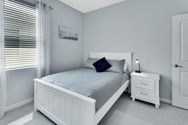 1580 Delphi Way, New Smyrna Beach, FL 32168 - bedroom with light carpet and baseboards