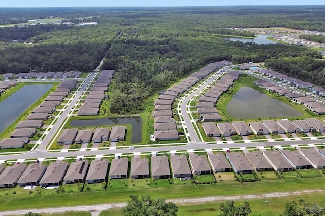 1580 Delphi Way, New Smyrna Beach, FL 32168 - view of property location with a heavily wooded area, a large body of water, and nearby suburban area