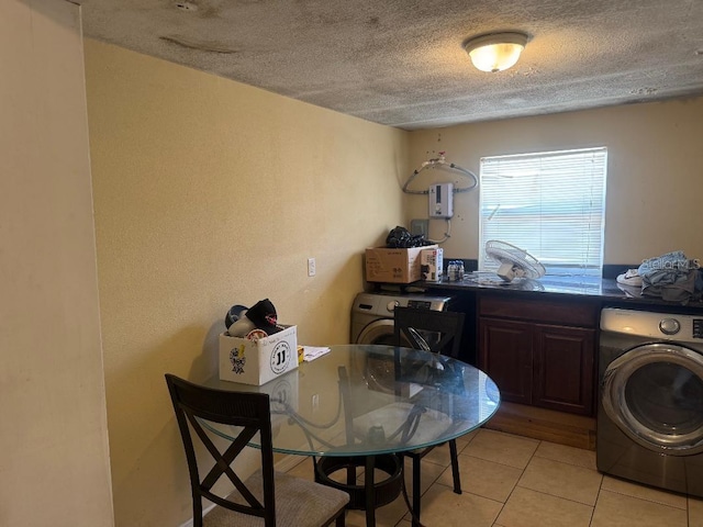 625 E Jackson Ave, Mount Dora, FL 32757 - washroom featuring washer / dryer, a textured ceiling, and light tile patterned floors