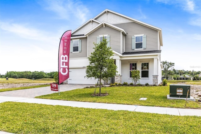 1262 Champions Dr, Daytona Beach, FL 32124 - view of front of home featuring a garage, driveway, and a front lawn