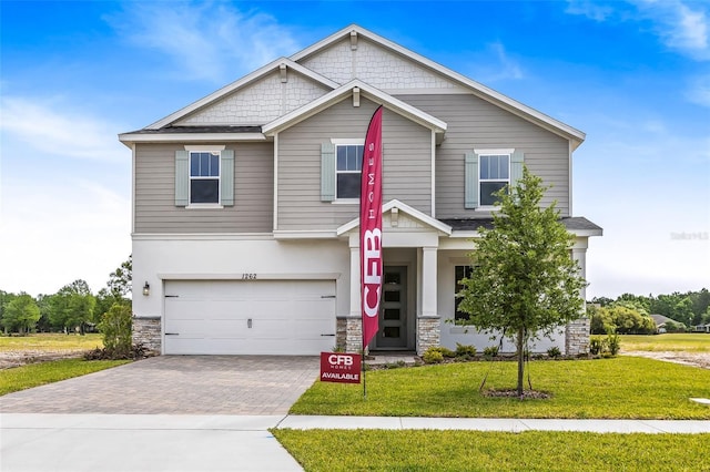1262 Champions Dr, Daytona Beach, FL 32124 - view of front facade with stone siding, a garage, a front lawn, and driveway