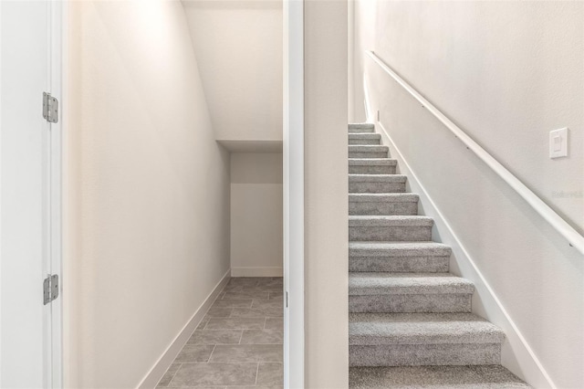 1262 Champions Dr, Daytona Beach, FL 32124 - staircase featuring baseboards