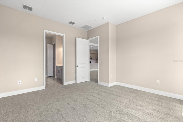 1262 Champions Dr, Daytona Beach, FL 32124 - unfurnished bedroom with carpet flooring, baseboards, and ensuite bathroom