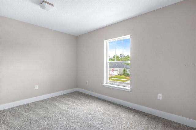 1262 Champions Dr, Daytona Beach, FL 32124 - carpeted empty room featuring baseboards