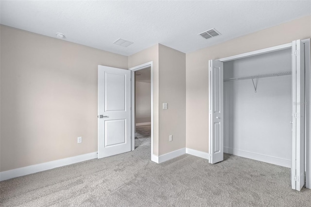 1262 Champions Dr, Daytona Beach, FL 32124 - unfurnished bedroom with carpet, baseboards, and a closet