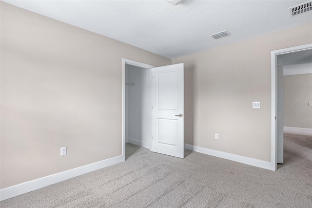 1262 Champions Dr, Daytona Beach, FL 32124 - unfurnished bedroom with carpet and baseboards