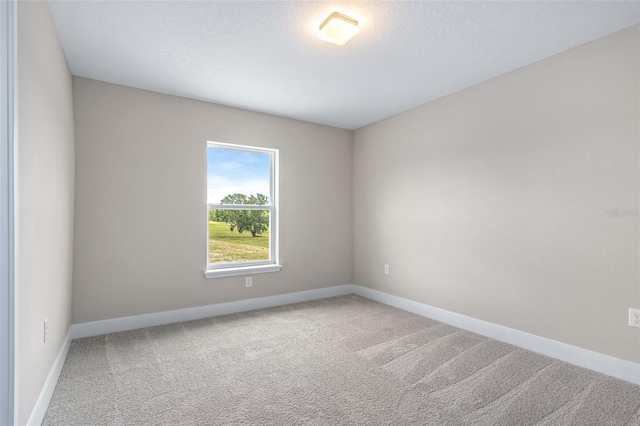 1262 Champions Dr, Daytona Beach, FL 32124 - unfurnished room featuring carpet floors and baseboards