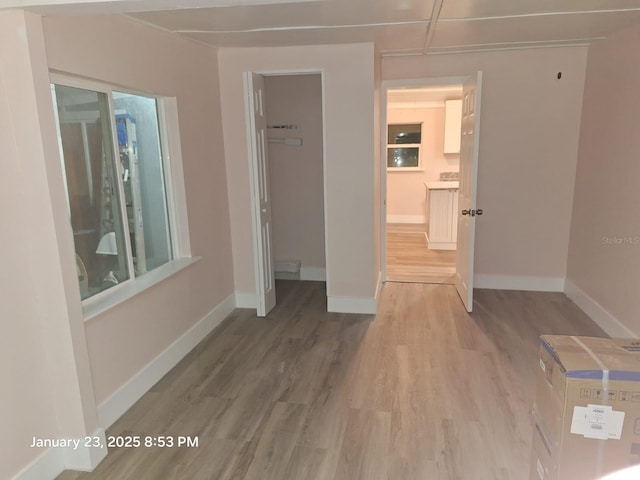 6505 Oelsner St, New Port Richey, FL 34652 - hall featuring light wood-style flooring and baseboards