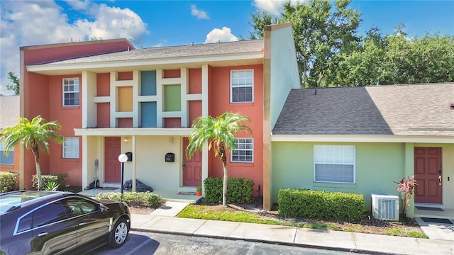 4952 Tangerine Ave Unit 4952, Winter Park, FL 32792 - townhome / multi-family property featuring stucco siding, uncovered parking, central air condition unit, and roof with shingles
