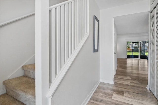 4952 Tangerine Ave Unit 4952, Winter Park, FL 32792 - staircase featuring wood finished floors and baseboards