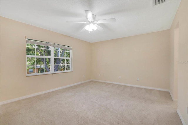 4952 Tangerine Ave Unit 4952, Winter Park, FL 32792 - empty room featuring light carpet, ceiling fan, and baseboards