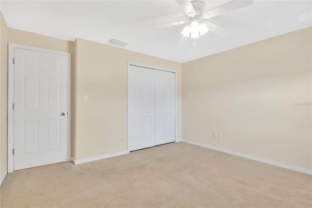 4952 Tangerine Ave Unit 4952, Winter Park, FL 32792 - unfurnished bedroom featuring light colored carpet, baseboards, a closet, and a ceiling fan