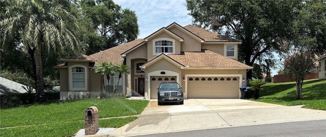 1445 Valley Pine Cir, Apopka, FL 32712 - view of front of property with stucco siding, concrete driveway, a garage, and a front yard