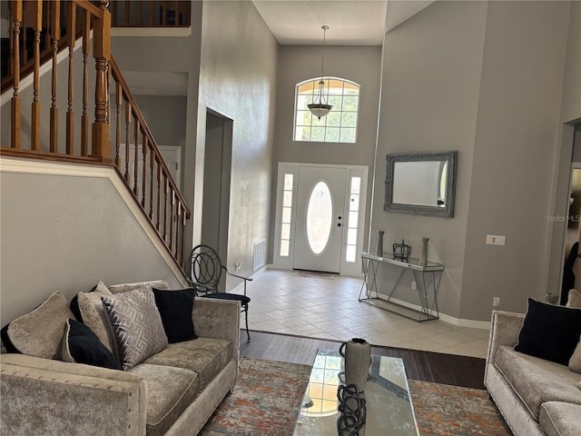 1445 Valley Pine Cir, Apopka, FL 32712 - tiled living area featuring stairway, baseboards, and a high ceiling