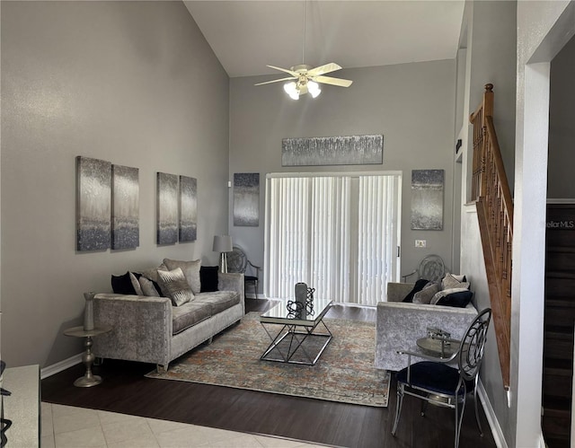 1445 Valley Pine Cir, Apopka, FL 32712 - living room with high vaulted ceiling, ceiling fan, stairway, tile patterned flooring, and baseboards