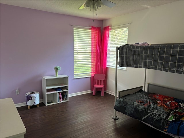 1445 Valley Pine Cir, Apopka, FL 32712 - bedroom with wood finished floors, baseboards, a textured ceiling, and ceiling fan