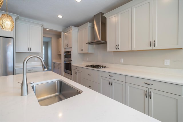 4861 Antrim Dr, Sarasota, FL 34240 - kitchen with wall chimney exhaust hood, recessed lighting, decorative light fixtures, stainless steel appliances, and light countertops