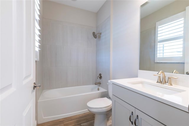 4861 Antrim Dr, Sarasota, FL 34240 - bathroom featuring vanity, wood finished floors, and bathing tub / shower combination