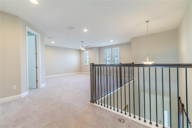 4861 Antrim Dr, Sarasota, FL 34240 - hall with an upstairs landing, carpet, and recessed lighting