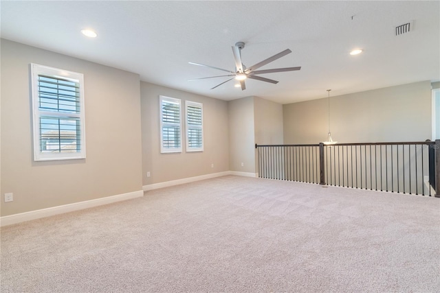 4861 Antrim Dr, Sarasota, FL 34240 - empty room with a ceiling fan, light carpet, and recessed lighting
