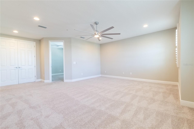 4861 Antrim Dr, Sarasota, FL 34240 - unfurnished bedroom with light carpet, recessed lighting, a closet, and a ceiling fan