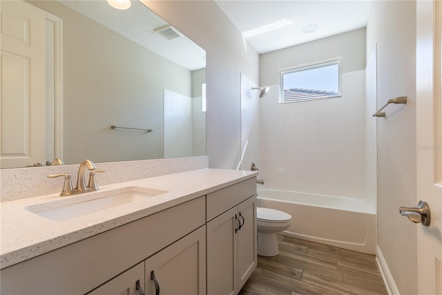 4861 Antrim Dr, Sarasota, FL 34240 - bathroom with vanity, wood finished floors, and shower / tub combination