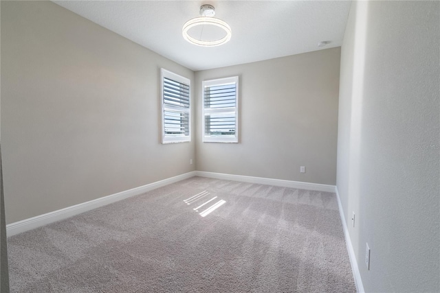 4861 Antrim Dr, Sarasota, FL 34240 - spare room with light colored carpet and baseboards