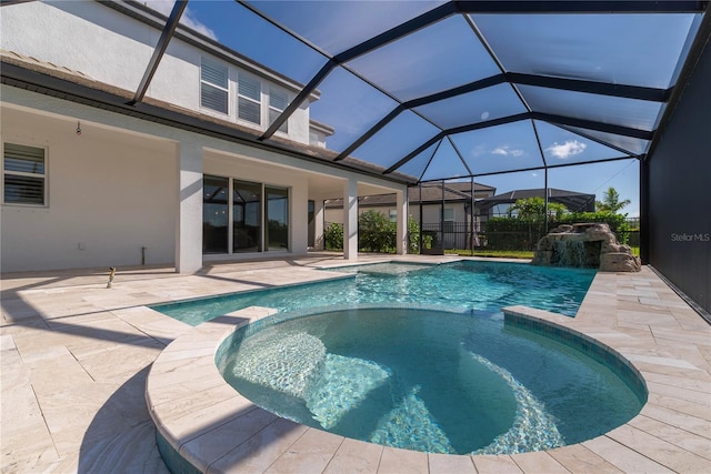 4861 Antrim Dr, Sarasota, FL 34240 - view of swimming pool with a pool with connected hot tub, a patio area, and glass enclosure