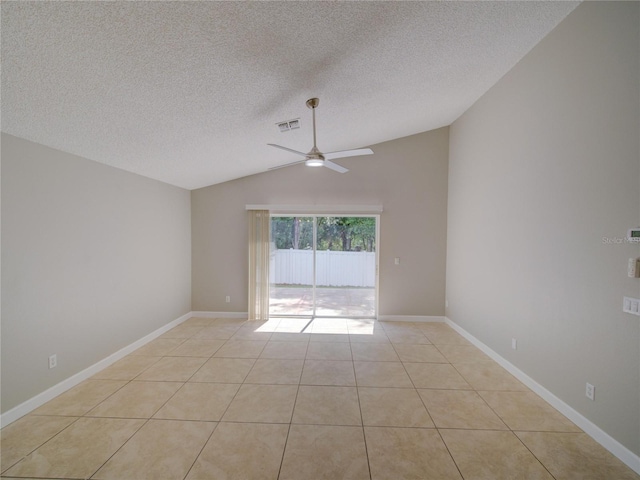 879 Nonastone Run, Casselberry, FL 32707 - spare room with vaulted ceiling, a ceiling fan, a textured ceiling, light tile patterned flooring, and baseboards