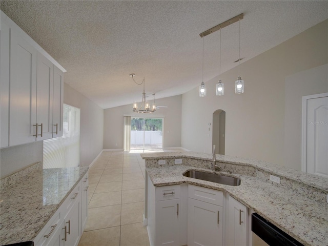 879 Nonastone Run, Casselberry, FL 32707 - kitchen with lofted ceiling, a sink, dishwasher, arched walkways, and a chandelier