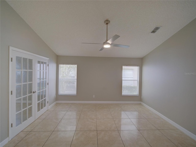 879 Nonastone Run, Casselberry, FL 32707 - empty room with french doors, ceiling fan, a textured ceiling, baseboards, and light tile patterned floors