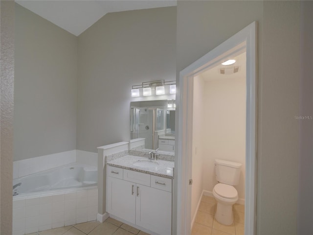 879 Nonastone Run, Casselberry, FL 32707 - full bath featuring tile patterned flooring, a bath, vaulted ceiling, vanity, and toilet