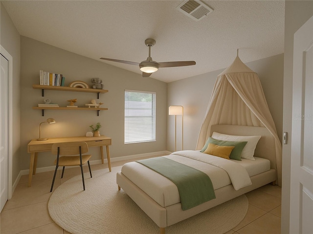 879 Nonastone Run, Casselberry, FL 32707 - bedroom featuring light tile patterned floors, vaulted ceiling, a ceiling fan, and baseboards