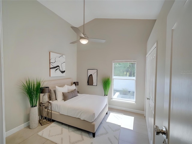 879 Nonastone Run, Casselberry, FL 32707 - bedroom with high vaulted ceiling, light tile patterned floors, and baseboards