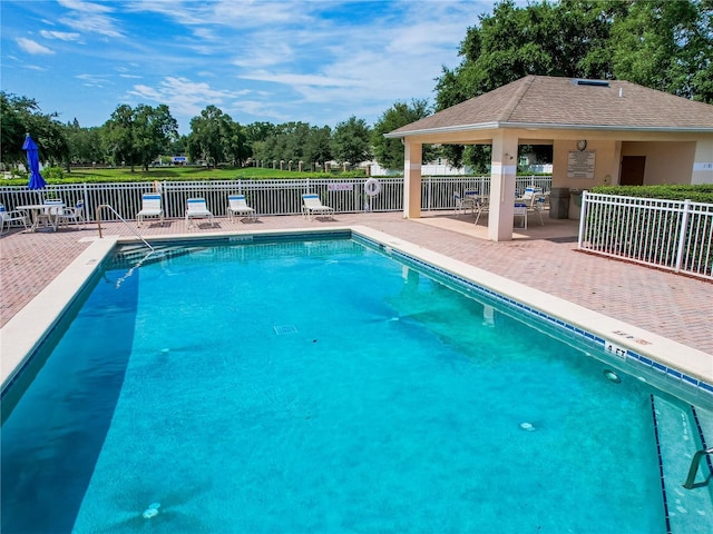 879 Nonastone Run, Casselberry, FL 32707 - community pool with a patio area, a gazebo, and view of wooded area