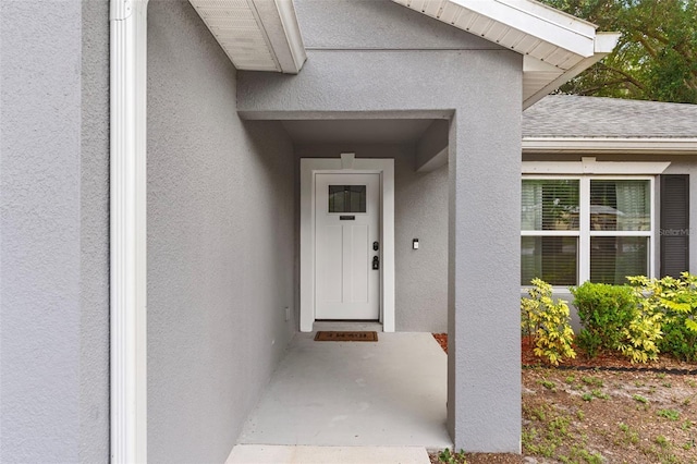 122 Seville Rd, Auburndale, FL 33823 - view of exterior entry featuring stucco siding