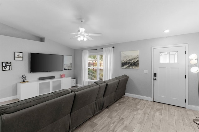 122 Seville Rd, Auburndale, FL 33823 - living room featuring vaulted ceiling, a ceiling fan, light wood-type flooring, and baseboards
