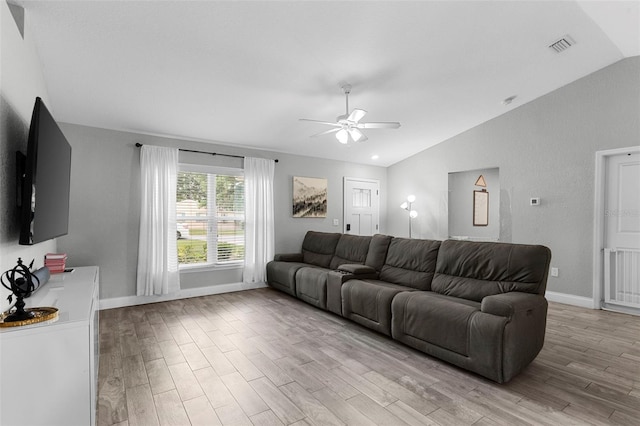 122 Seville Rd, Auburndale, FL 33823 - living area with lofted ceiling, a ceiling fan, light wood-style floors, and baseboards